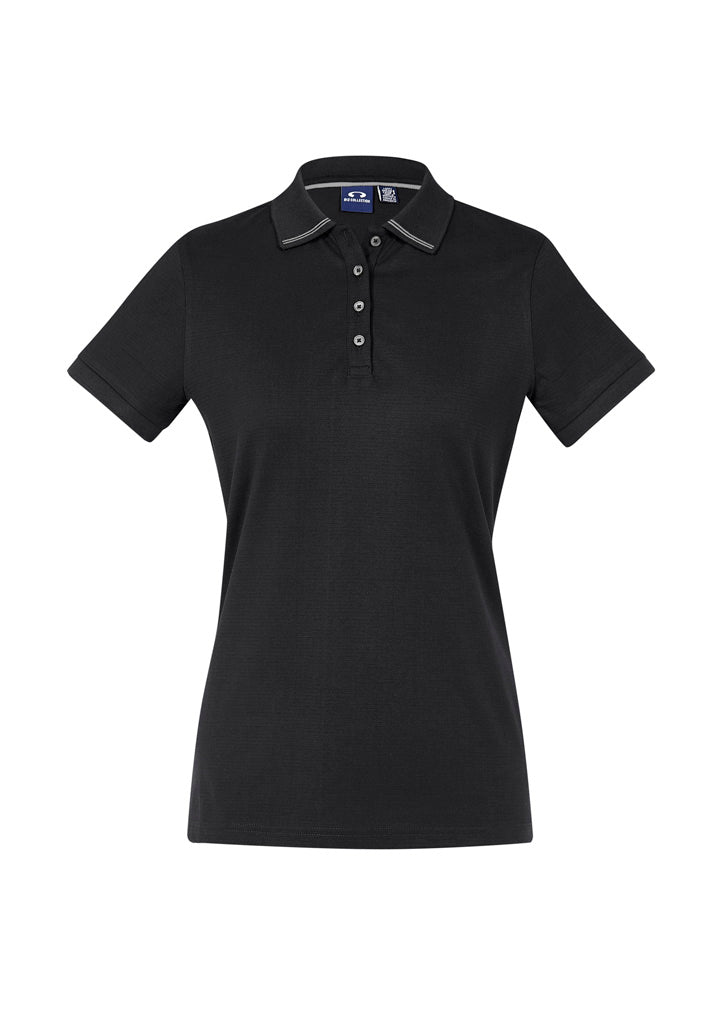 Image depicting a woman wearing an Athens Cotton Jersey Knit Women's Polo on a day out in the park.