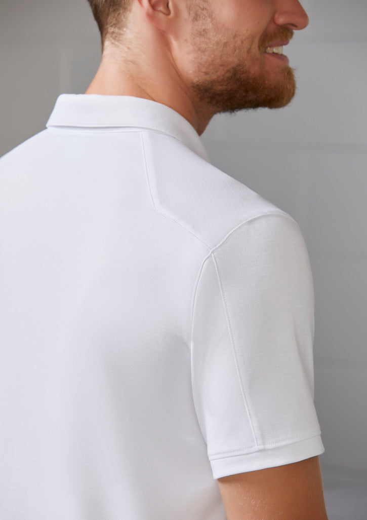 Image of a man wearing an Oxbow Cotton Polyester Men's Polo at a casual gathering.