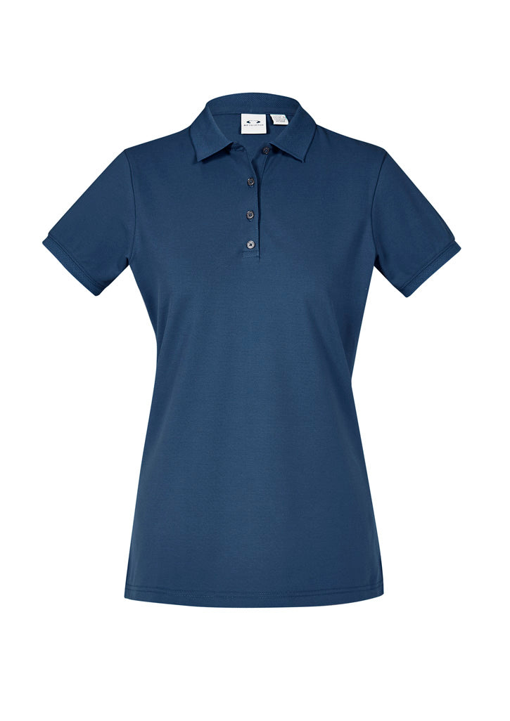 Image showing a woman in an UrbanTee Cotton Women's Polo at a cafe.