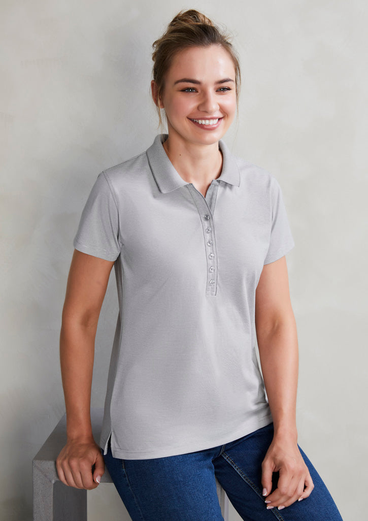Image showing a woman wearing a Midnight Cross-Dyed Fabric Women's Polo at a night out.